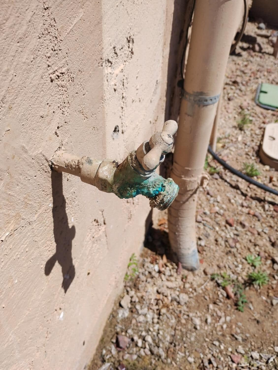 Before: Heavily corroded, failing outdoor hose bib