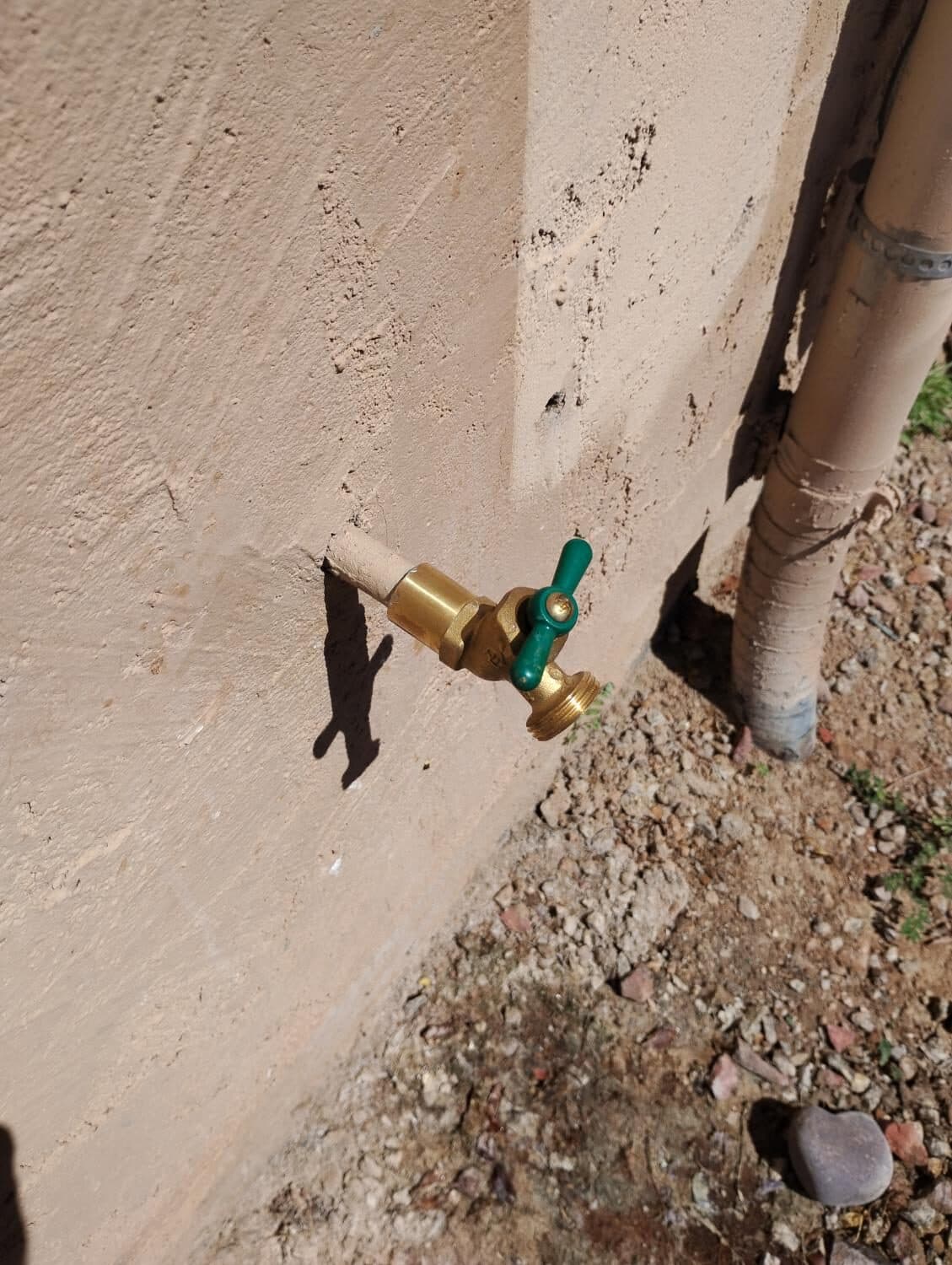 After: New brass hose bib with green handle — clean, reliable, and ready for years of use