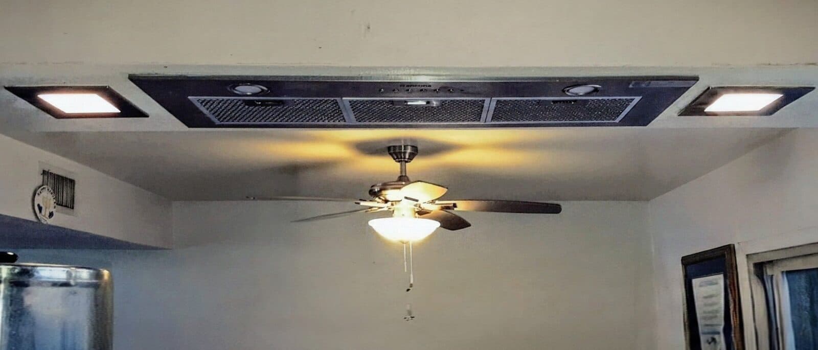 After: Professional Ancona rangehood + matching recessed lighting. Clean lines, quiet power.