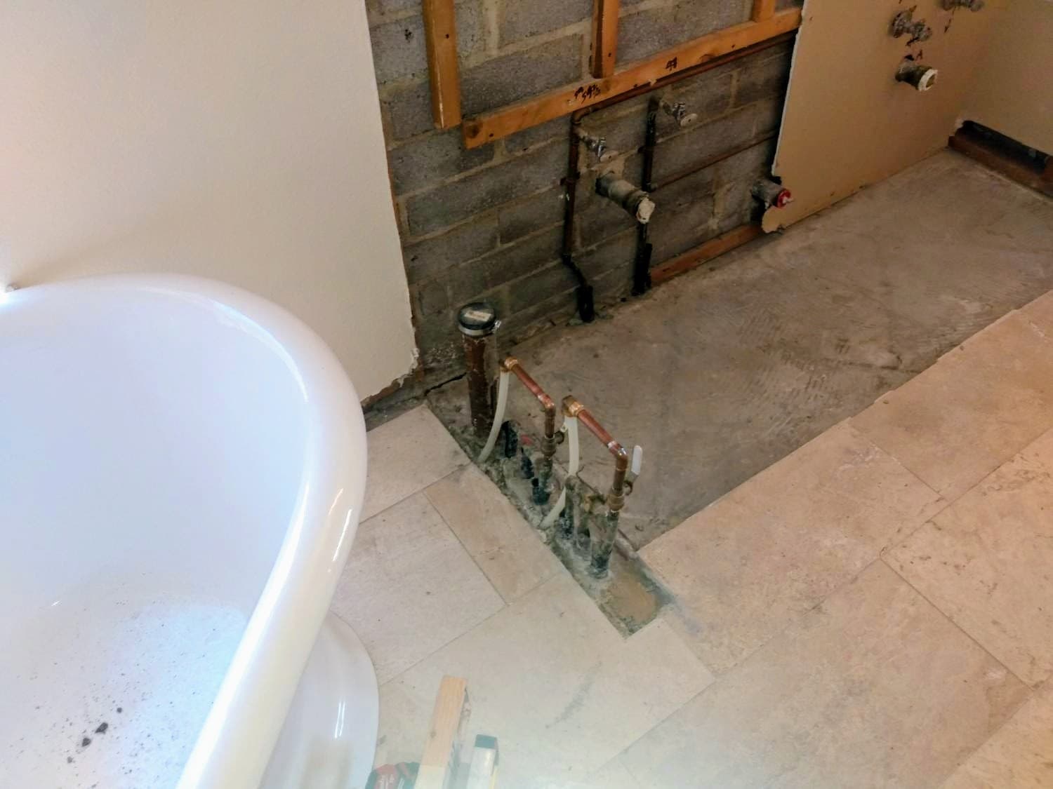Before: preconstruction layout at the vanity wall so the plumbing, electrical, and drywall plan starts from a clean baseline.