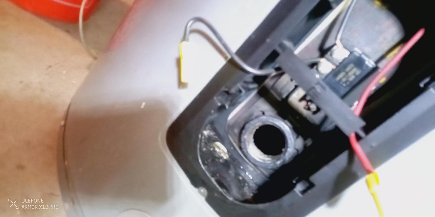 During: the heating element is removed so the failed part can be checked instead of guessing.